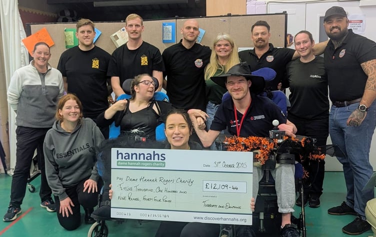 Tugboats and Dolphins hand over a cheque to Dame Hannahs after a year of fundraising.